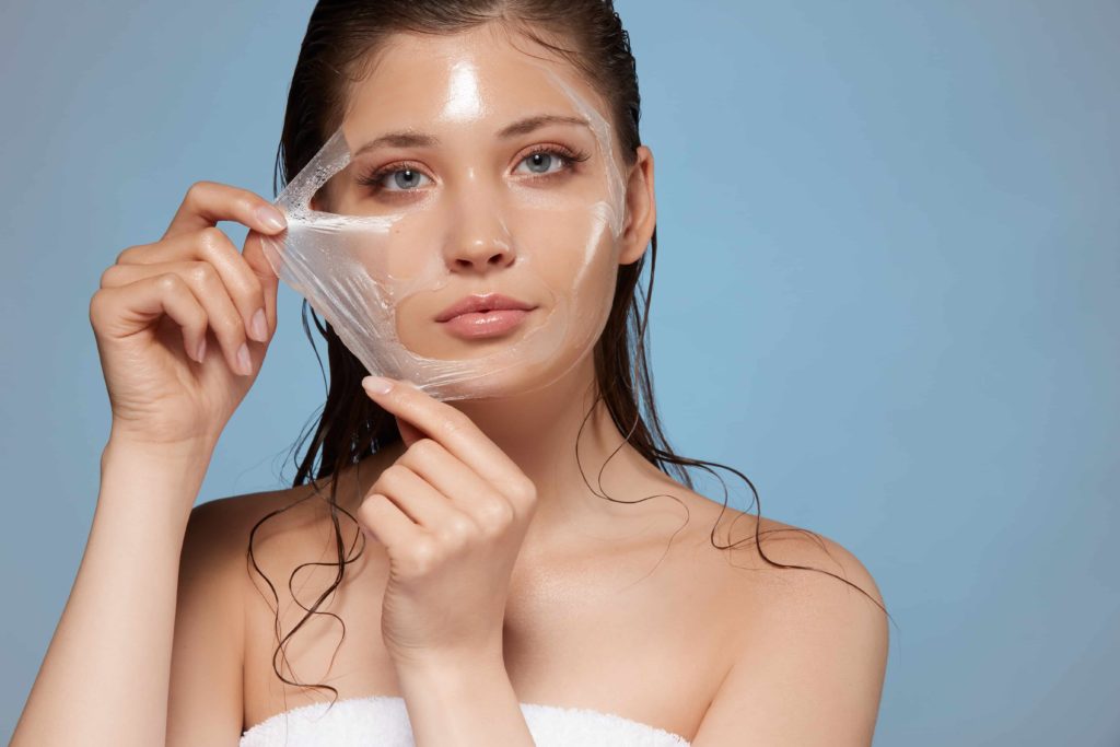 Attractive woman removing moisturizing mask and looking at camera | SKYNN MD in Holly Springs, NC