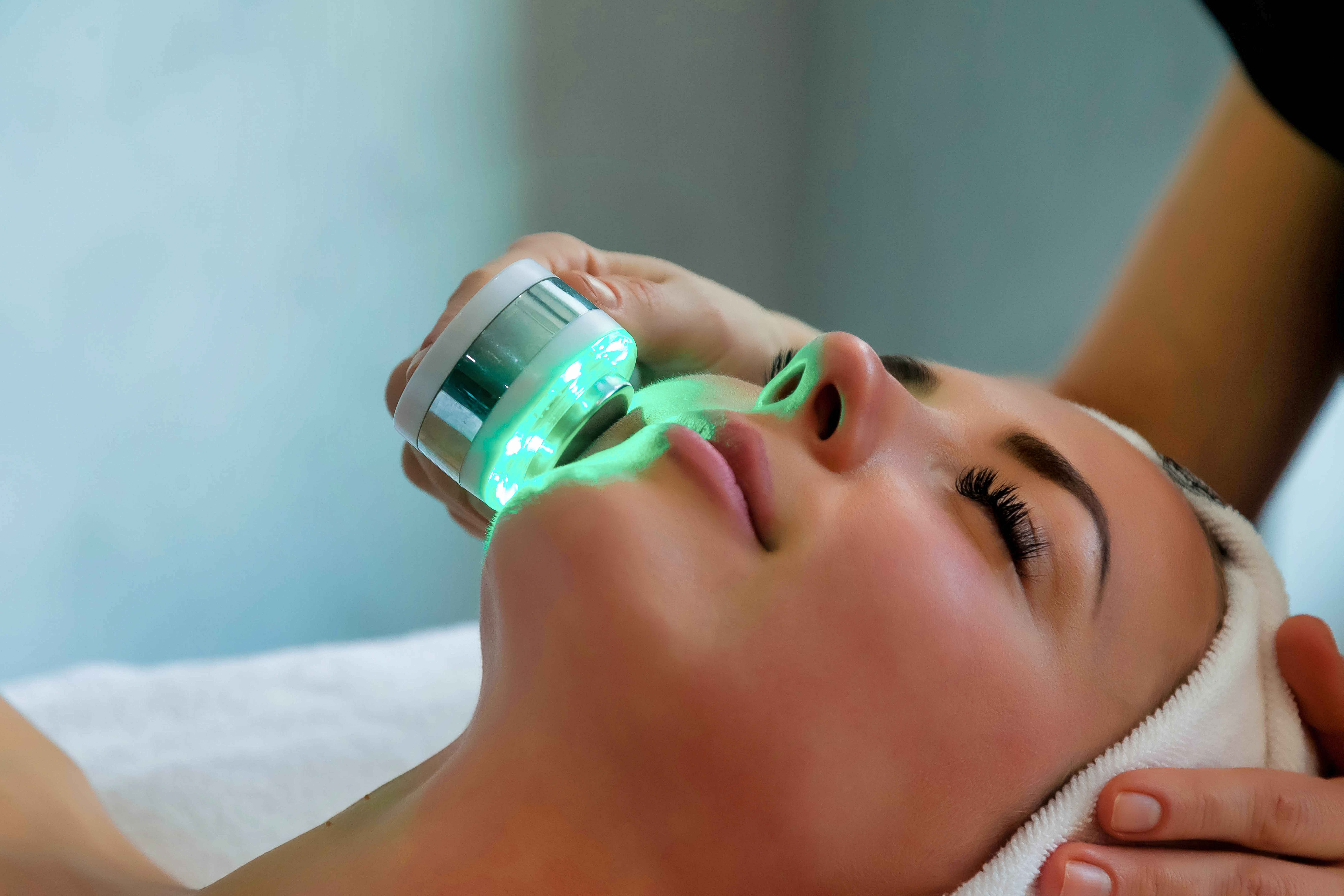 A Female getting LED Light Therapy | SKYNN MD in Holly Springs, NC
