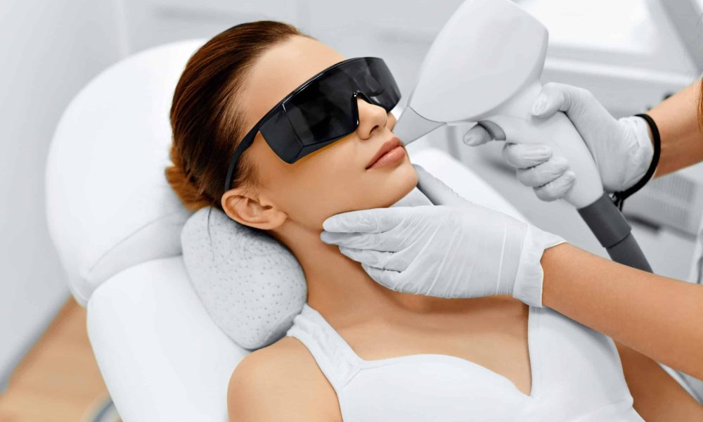 Laser hair removal treatment. Doctor holding. Clinic skin care procedure. Medical dermatology photo equipment. People epilation device. Cosmetology technology salon epilation. Body aesthetic | SKYNN MD in Holly Springs, NC
