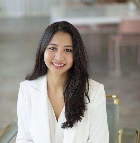 a woman in a white suit
